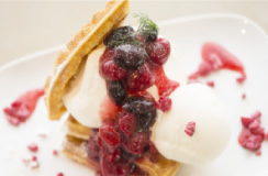 The Very Berry Waffle, splashed with a rich dose of ripe, sweet, and sour, berry sauce.